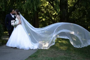 The reception center patio, bride and groom with veil flying