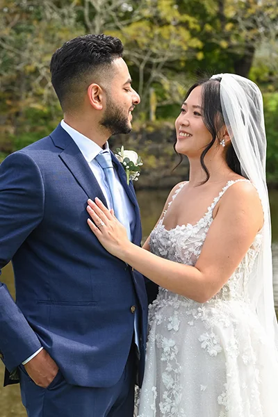 bride and groom smiling - top wedding photographer MC Productions