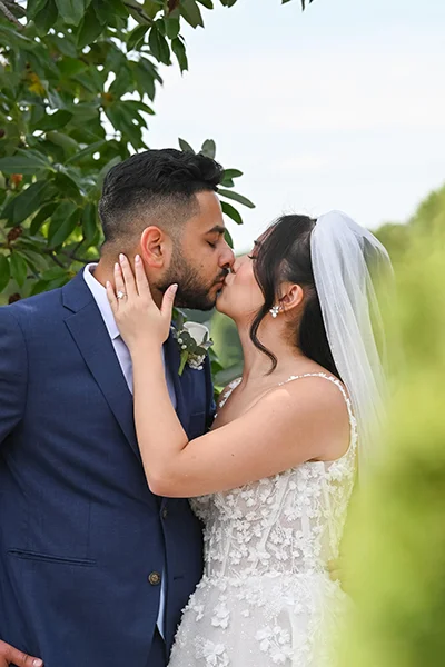 bride and groom kissing - top wedding photographer MC Productions
