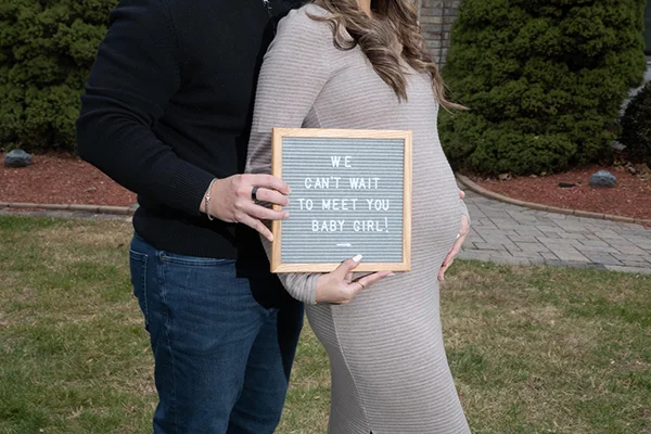 MC Productions NJ – Luxury maternity photography with partner embracing baby bump