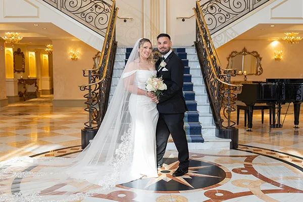 The Grove NJ Wedding photographer and Videographer - Bride and groom in the staircase