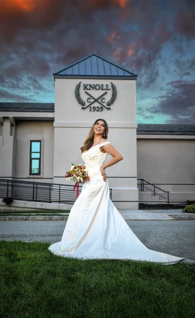 Wedding Photographer – MC Productions – Knoll Country Club, bride in front of Knoll CC 1929 clubhouse sign